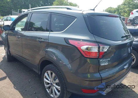 2017 Ford Escape Titanium z USA, uszkodzony, nr VIN 1FMCU9J99HUE27597